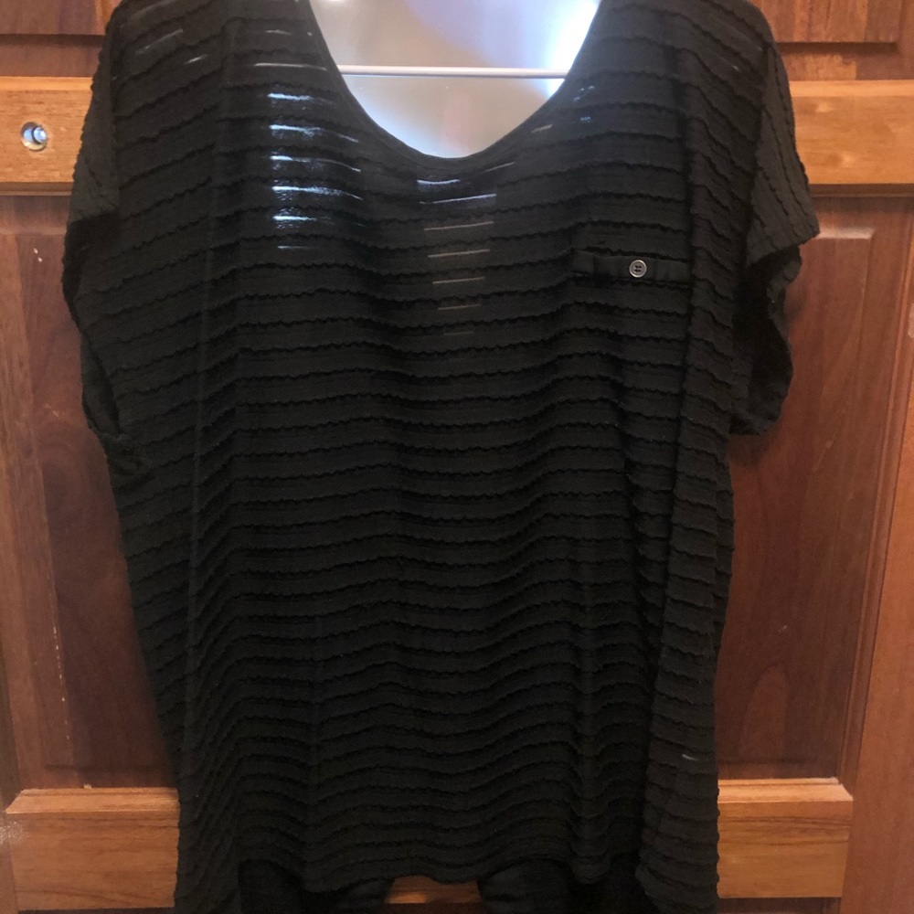 Maurice’s black top with buttons on the back